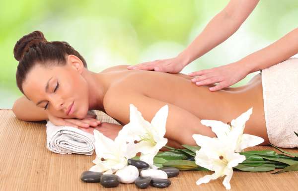 Beautiful woman enjoying a massage therapy Beautiful woman enjoying a massage therapy